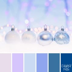 the color scheme is blue and white with silver baubles on it, as well as other ornaments