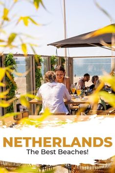 two people sitting at an outdoor table with the words netherlands on it