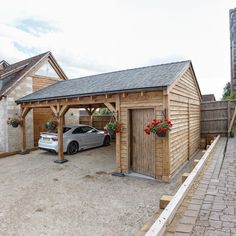 a car parked in front of a wooden garage