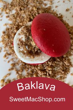 a close up of a dessert on a plate with the words bakava above it