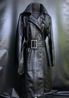 The BLACK SNAKESKIN LEATHER COAT is one of the jewels of the outerwear collection. OUTSIDE: SNAKESKIN STANDART LENGHT: 105 CM ⠀ A coat of laconic design with a unique texture of snakeskin and with a magical shade - truly ROYAL LUXURY. This model was created for women who know how to emphasize nobility and impeccable taste with their style. In a python skin coat your every look will be ARISTOCRATIC and, at the same time, trendy. ⠀ We believe our coat will become one of the favorite items in your Collaboration Aesthetic, Leather Dress Outfit, Textured Coat, Black Leather Coat, Python Skin, Long Coat Women, Leather Trench, Leather Trench Coat, Trench Coats Women