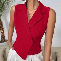 Elevate Your Wardrobe With The Striking Red Double-Breasted Sleeveless Blazer, A Perfect Blend Of Sophistication And Modern Elegance. This Vest-Style Blazer Showcases A Stunning Asymmetrical Hem And A Classic Lapel Neckline, Making It A Standout Piece For Any Occasion. The Double-Button Closure Adds A Touch Of Refined Detail, While The Vibrant Red Color Ensures You Make A Bold Statement. Crafted From High-Quality Woven Fabric, This Blazer Features A Regular Fit That Exudes Confidence And Style. Fitted Sleeveless Office Vest, Red V-neck Vest For Spring, Fitted Red Vest For Summer, Red Fitted Vest For Summer, Red Fitted Sleeveless Vest, Red Sleeveless Formal Tops, Formal Red Sleeveless Top, Red Sleeveless Party Vest, Elegant Red V-neck Tank Top