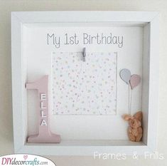 a baby's first birthday frame with a teddy bear and letter i on it