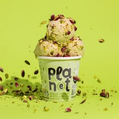 an ice cream cup with pistachio sprinkles