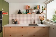 the kitchen counter is clean and ready to be used as a storage area for dishes