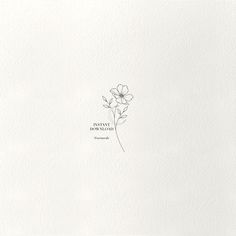 a single flower is shown in the middle of a white paper with an inscription on it