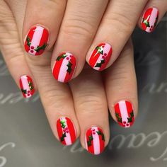 You can rock festive nails while throwing a touch of pink in the mix, too. These pink and red striped nails are positively party ready with their cute little holly accents, which, BTW, are easy to DIY with nail dotting tools. Red Striped Nails, Festive Nails Christmas, Red Nail Ideas, Red Chrome Nails, Nail Dotting Tool, Christmas Nail Art Easy, Festive Nails, Metallic Nail Art, Velvet Nails