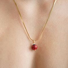 Bring a dash of charm to your look with our Snake Chain Ladybug Necklace. Featuring a handcrafted Murano glass ladybug bead, each necklace is one-of-a-kind, making it as unique as you are. The sleek, stainless steel snake chain adds a modern touch, while the delicate ladybug adds a playful accent. With a length of approximately 50 cm, this necklace complements a variety of styles, though slight variations in size add to its individual character. Packaged in an elegant Smilla Brav jewelry box, it Dainty Red Necklace With Lobster Clasp, Snake Chain Charms Necklace For Gift, Dainty Handmade Red Charm Necklaces, Red Pendant Jewelry For Everyday, Handmade Dainty Chain Necklace For Jewelry Making, Handmade Snake Chain Necklace Gift, Handmade Red Necklace For Everyday, Everyday Handmade Red Necklaces, Red Necklace With Adjustable Chain For Everyday