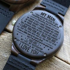 a wooden watch with the words i love you written on it