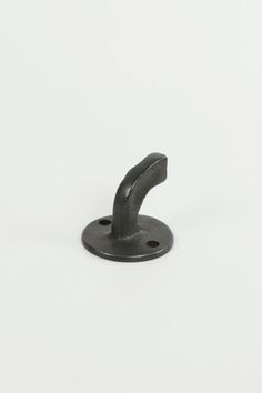 a black metal object on a white background