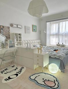 a bedroom with a bed, desk and mirror