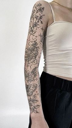 a woman with a tattoo on her arm