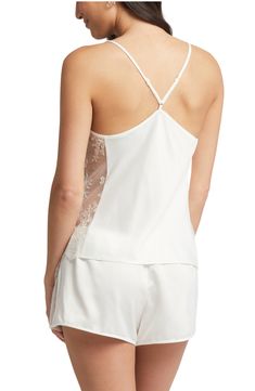 Silky charmeuse beautifully glides down your figure on this drape-neck chemise simply detailed with sheer lace sides. 23" top length; 2" inseam; 13 1/2" leg opening; 10 1/2" front rise; 12" back rise Top has drape neck; adjustable straps Shorts have elastic waist 100% polyester Hand wash, dry flat Imported Lingerie Satin Sleepwear With Built-in Bra For Wedding Night, Elegant Camisole Sleepwear For Bedtime, Elegant Cami Sleepwear For Loungewear, Sheer Satin Sleepwear, Elegant Summer Sleepwear With Delicate Straps, Elegant Cami Sleepwear For Spring, Elegant Spring Camisole Sleepwear, Chic Fitted Silk Sleepwear, Lace Camisole With Spaghetti Straps For Sleep