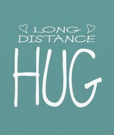 the words long distance hug written in white on a teal green background with hearts