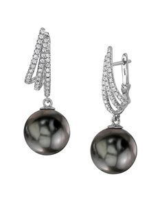 These exquisite earrings feature 11mm high-quality Tahitian South Sea pearls, handpicked for their incredible luster and overtones. The pearls are mounted on the finest 18K gold with .35 carats of dazzling SI clarity diamonds. These earrings come packaged in a beautiful jewelry gift box, perfect for gifting. Luxury Black Pearl Earrings For Anniversary, Luxury Tahitian Pearl Jewelry For Wedding, Classic Tahitian Pearl Earrings For Formal Occasions, Elegant Tahitian Pearl Earrings For Anniversary, Elegant Tahitian Pearl Round Earrings, Elegant White Gold Tahitian Pearl Earrings, Elegant Round Tahitian Pearl Earrings, Elegant Tahitian Pearl Earrings For Formal Occasions, Anniversary Tahitian Pearl Drop Earrings