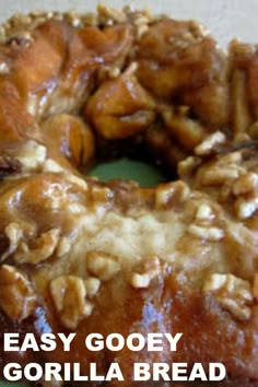 a close up of a doughnut with nuts on it and the words easy gooey gorilla bread