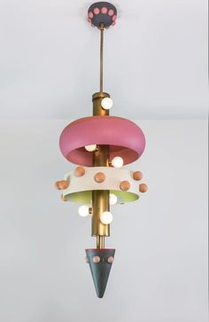 a multicolored light fixture hanging from the ceiling