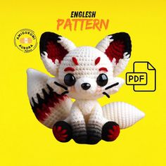 a crocheted stuffed animal sitting on top of a yellow book with the title english pattern