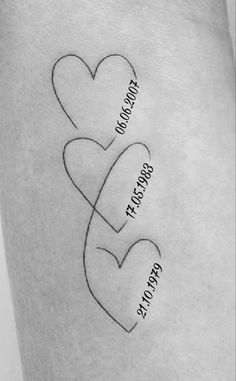 two hearts with names on each side of the arm