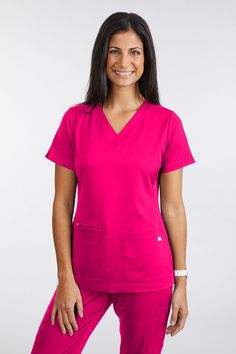 DESCRIPTION Instant comfort and professionalism are combined in this figure flattering top. As a chic and refined version of the timeless V-neck style, the Melanie top stands out with super soft, breathable, 4-way stretch fabric. Pockets you say? This top has the right amount in the perfect places, as well as a modern fit with princess lines that move and bend with you for a non stop comfort experience. BTW, The Melanie Scrub Top pairs beautifully with the Catherine Pant and The Justine Jogger Scrubs for women. The Diana Jacket completes your look for those days when the AC is stuck on high! DETAILS Moxie Signature Comfort Panels allow you to move freely while enjoying super soft scrubs against your skin Modern V-Neck Front and Back Seams to curve with your curves 2 Front Loading Pockets Z Plus Size Scrubs, Nursing Scrubs Pattern, Jogger Scrubs, Scrubs Pattern, Fun Scrubs, Scrubs For Women, Blue Carnations, Wonderwink Scrubs, Navy Blue Scrubs