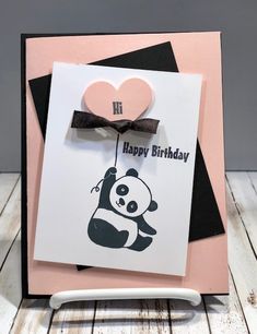 a birthday card with a panda holding a heart