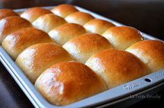 freshly baked bread rolls in a baking pan