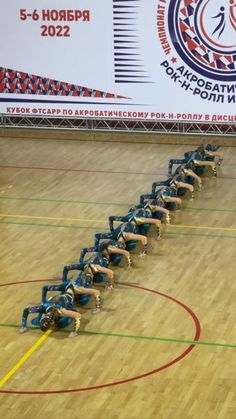 a group of people on roller skates in a gym