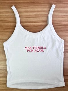 Stand out from the crowd and make a lasting impression with our Custom Embroidered Crop Top Tank. Perfect for team uniforms, bridal parties, bachelorette gifts, or retail merchandise! ✨Please note that my processing times are 2-3 weeks, and that does not include shipping time. Shipping time is an additional 3-5 business days, depending on the type of shipping you select at checkout. Please do not leave "need by" instructions in the notes, they will not be honored.✨ -52% cotton, 48% polyester. Th Fitted Summer Tops With Embroidered Graphics, Fitted White Tank Top With Floral Embroidery, White Fitted Tank Top With Floral Embroidery, White Embroidered Cotton Tank Top, White Embroidered Cotton Crop Top, White Fitted Tops With Custom Embroidery, Fitted White Tops With Embroidered Text, White Tanks, Bridesmaid Tank Tops