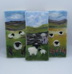 three sheep are standing in the grass near each other