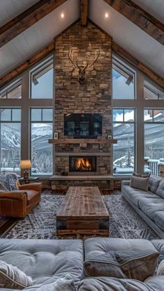 a living room with couches and a fire place in it's center area