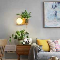 a living room filled with furniture and a painting on the wall next to a coffee table