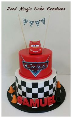 a red and white cake with cars on it