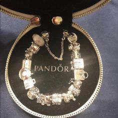 Bracelet 7.1 Include 19 Charms Box Cupcake, Girl,M, Gift Box,Pandora Bag,Giraffe,Love,Baby Carrier,Gift,Elephant,Dollar Bag,Luggage,Coffee Mug,Love Envelope,Buddha, Jewelry Box,Pink Mirando Charm, 1 Clo, 1 Spacer I Took It To Pandora Store Appraisal For $875 Luxury Silver Jewelry For Birthday Gift, Luxury Charm Bracelet - Perfect Gift, Luxury Charm Bracelet For Gift, Luxury Charm Bracelet As Gift, Luxury White Gold Charm Bracelet Gift, Luxury Silver Jewelry In Gift Box, Elegant Silver Charm Bracelet For Gifting, Silver Jewelry In Original Box For Anniversary, Elegant White Bracelet For Birthday Gift