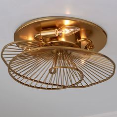 a gold ceiling light with an intricate design