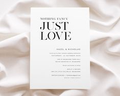 a white wedding card with black lettering on it that reads, nothing fancy just love