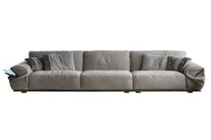 a gray couch with pillows on it