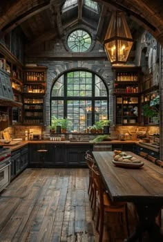 an old fashioned kitchen with wooden floors and large arched window above the countertop area