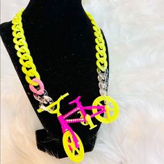 “Take A Ride On The Wild Side With This Beautiful Handmade Bicycle Necklace”. It Features Bold, And Vibrant Neon Colors Such As Pink And Yellow On A Acrylic Chain Along With A Rhinestoned With Center Piece That’s Sure To Be A Eye Catcher. T Shirt Necklace, Bicycle Necklace, Anthropologie Necklace, Swarovski Pearl Necklace, Triple Layer Necklace, Vintage Gold Necklace, Layered Choker Necklace, Arrowhead Necklace, Key Pendant Necklace