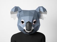 a person wearing a black shirt with a bear head on it's face and the bottom half of their body is made out of paper