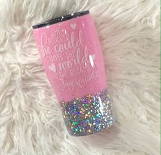 a pink and silver glitter tumbler with the words she needed because she loved her world