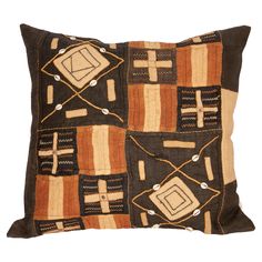 a brown and tan pillow with squares on it