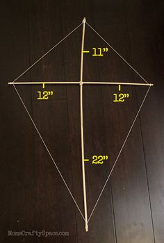 a wooden floor with measurements for a kite on it