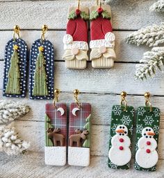 christmas ornaments are displayed on a wooden table