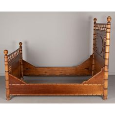 an antique wooden bed frame with intricate carvings