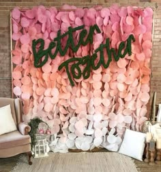 there is a wall decorated with pink and green paper hearts that say, better together