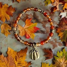 It's Autumn. It's pumpkin season. Oranges, reds, golds...I love all of it. This 7-1/2" stretch bracelet lets you enjoy the Autumn colors and pumpkin season everwhere you go. Carnelian gemstones with antique gold accent disks. B165 Fall Jewelry Ideas, Pumpkin Bracelet, Autumn Bracelet, Pumpkin Season, Pumpkin Seasoning, Business Idea, Bracelet Ideas, Fall Jewelry, Wire Crafts