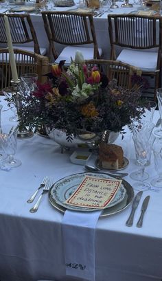 the table is set with plates and silverware