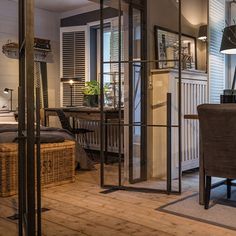 a living room filled with furniture next to a wooden floor