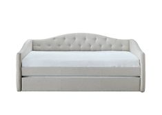 the daybed is white and has buttons on it