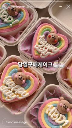 four cupcakes with teddy bears in the shape of hearts and letters on them